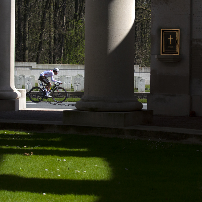 Gent - Wevelgem 2022 - Greg van Avermaet, riding for AG2R Citroën Team is framed by the pillars of the Memorial to the Missing at Ploegstraat