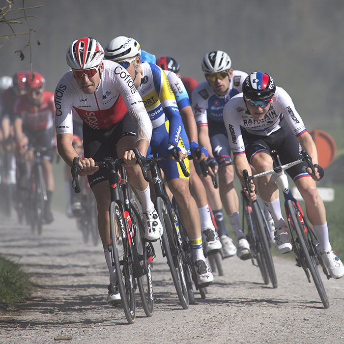 Gent - Wevelgem 2022 - Riders race down one of the Ploegstreet’s kicking up white dust