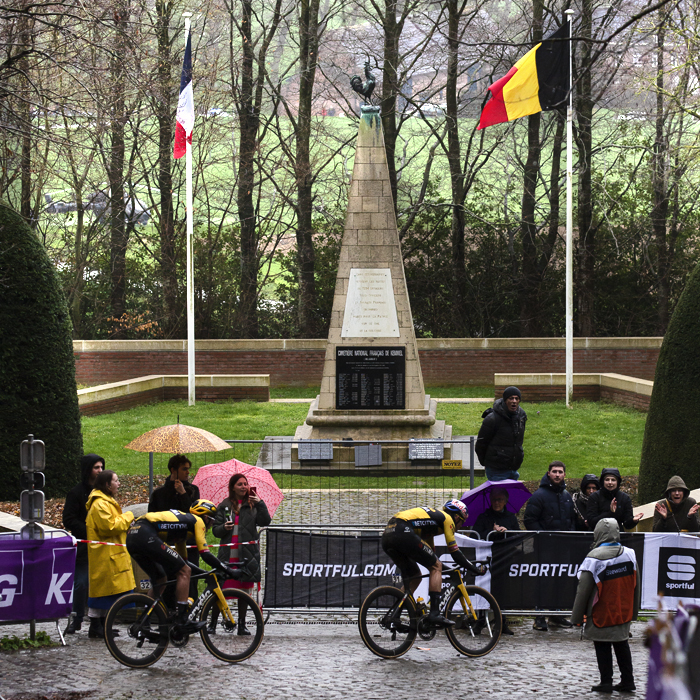 Gent - Wevelgem 2023 - Riders pass the Ossuaire monument with the French and Belgium flags flying