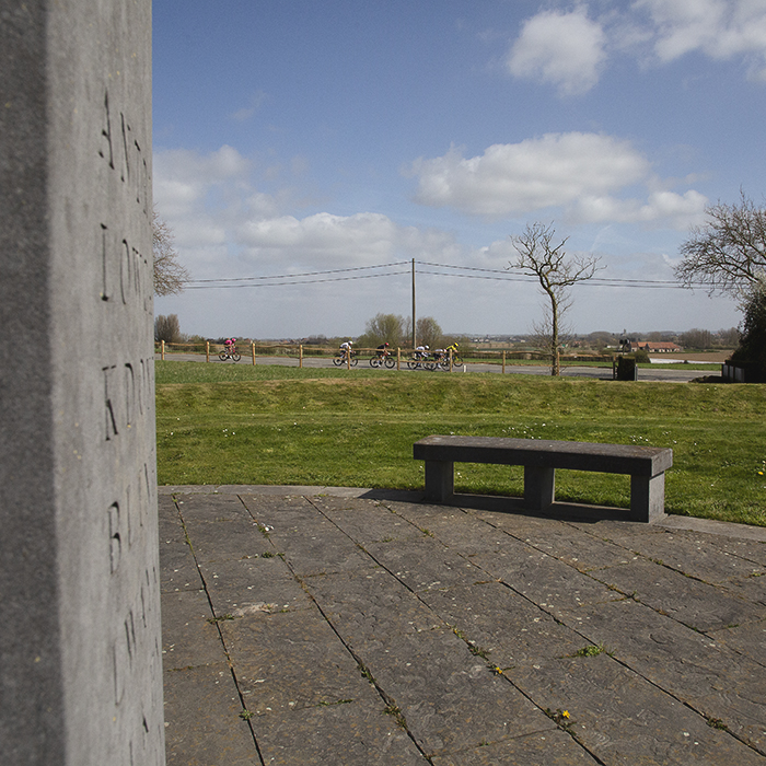 Gent Wevelgem 2025 - A group of riders viewed from the Iers Vredespark