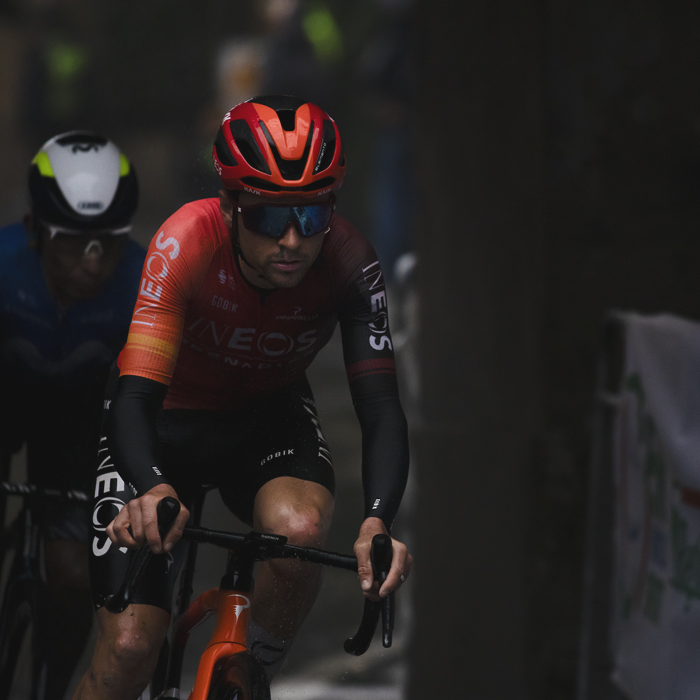 Giro dell’Emilia 2024 - Tom Pidcock rides under Arco Del Meloncello