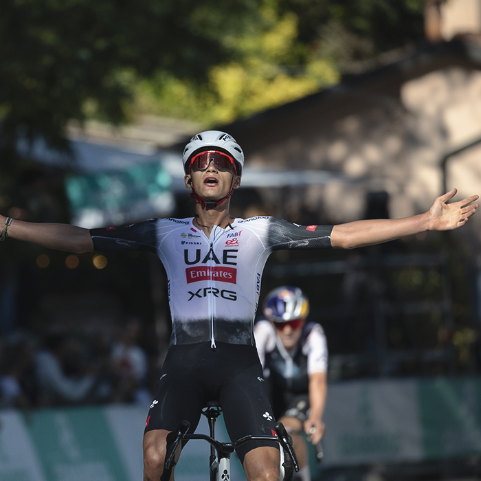 Giro dell’Emilia 2025 - Isaac del Toro stretches out his arms as he crosses the finish line victorious