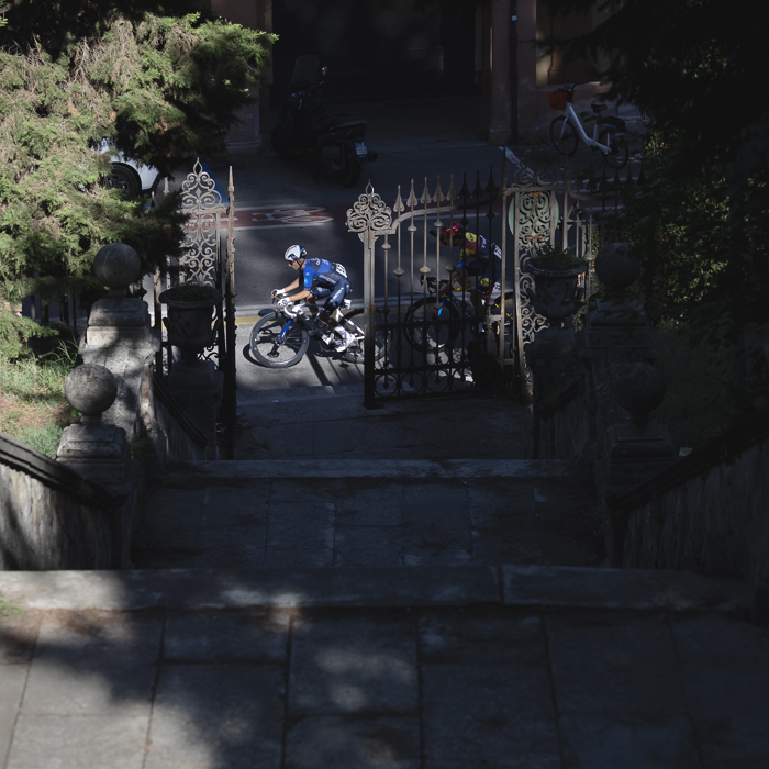 Giro dell’Emilia 2025 - Rémy Rochas framed by ornate gates in Bologna
