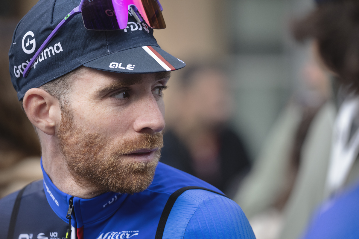 Giro dell’Emilia 2025 - Quentin Pacher looks to his side sunglasses perched on his cap