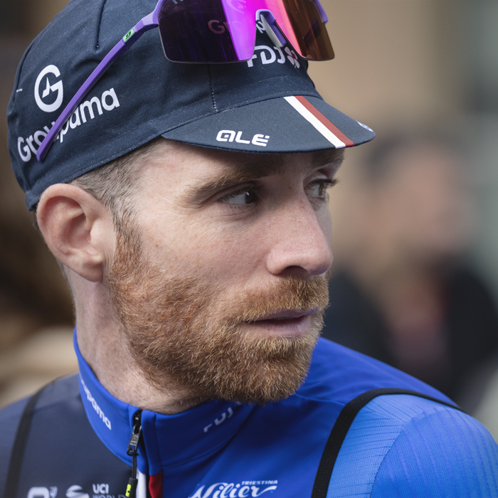 Giro dell’Emilia 2025 - Quentin Pacher looks to his side sunglasses perched on his cap