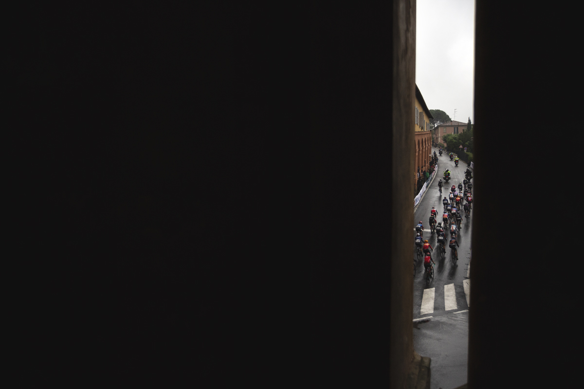 Giro dell'Emilia Internazionale Donne Elite 2024 - The race from behind as it climbs Via di San Luca viewed between columns