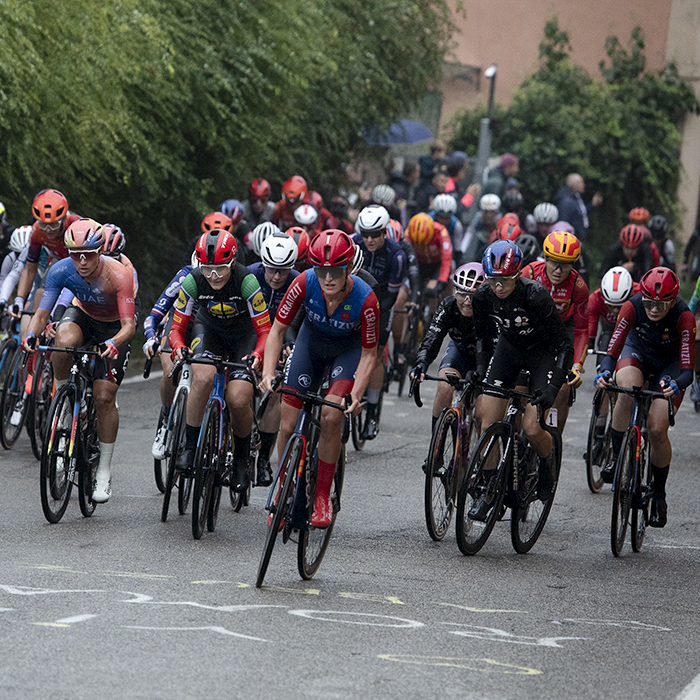 Giro dell'Emilia Internazionale Donne Elite 2024 - The peloton passes over writing on the road on Via di San Luca
