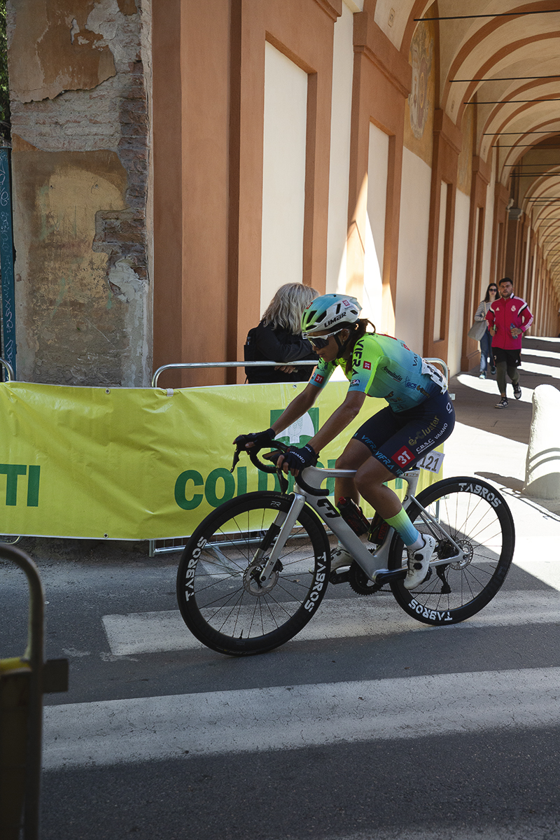 Giro dell'Emilia Internazionale Donne Elite 2025 - Irene Affolati passes under an archway of the portico on the San Luca climb