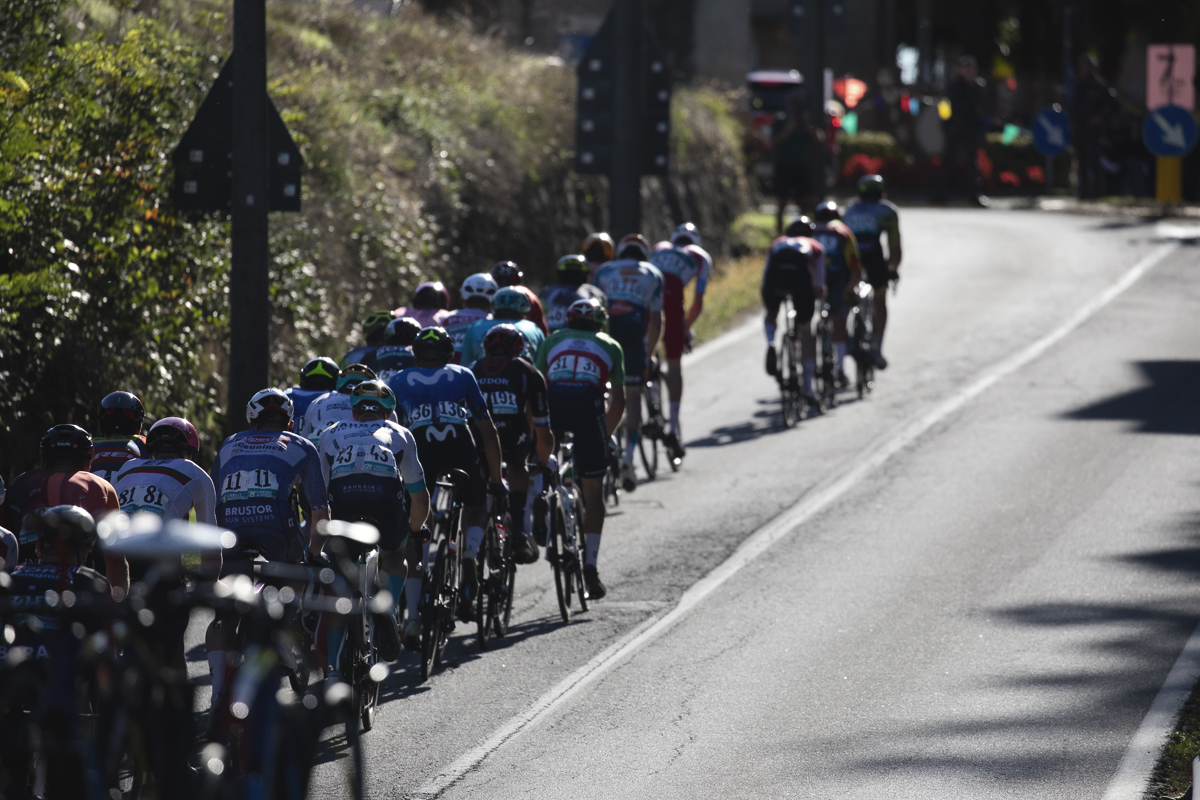 Gran Piemonte 2024 - A group of riders from behind make their way off the climb into the settlement of Maggiora
