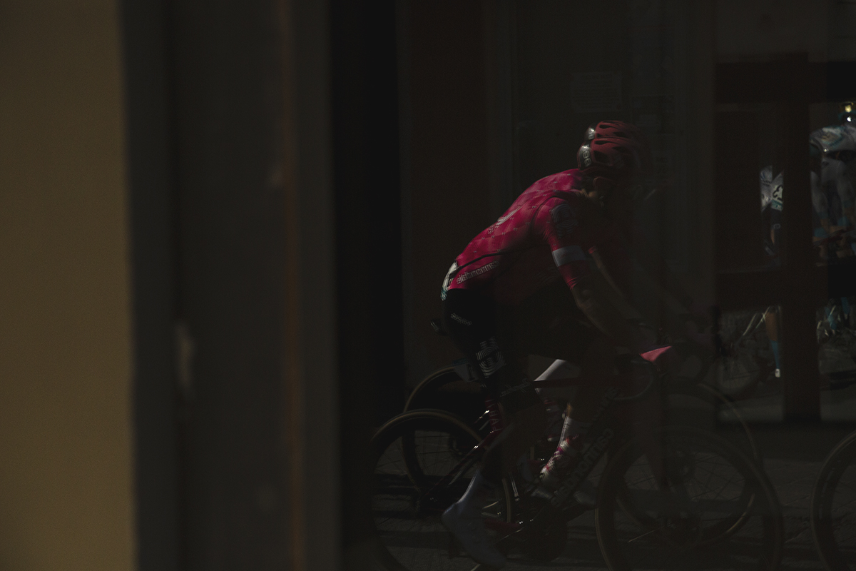 Gran Piemonte 2025 - A rider is reflected in a shop window in Acqui Terme