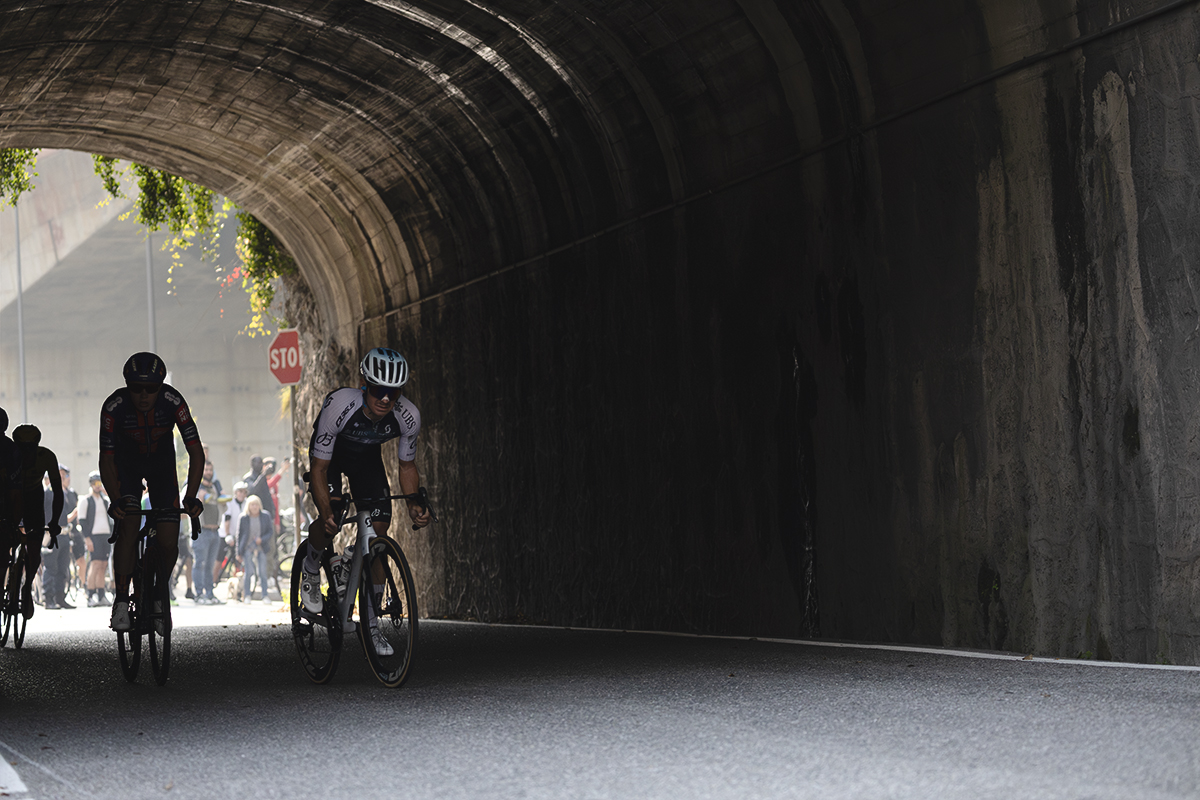 Il Lombardia 2025 - Xabier Mikel Azparren leads a group of riders out of a tunnel in Ponti