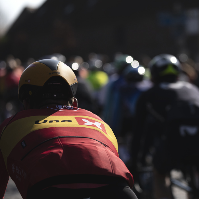 Kuurne Brussel Kuurne 2025 - A rear view of an UNO - X rider as they tackle the cobbles of Volkemberg