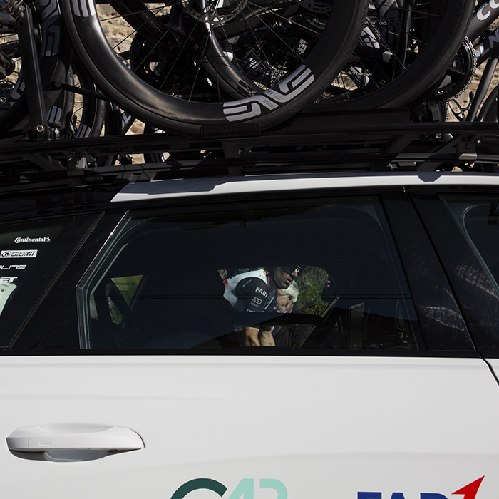 La Flèche Wallonne 2023 - One of the UAE Team Emirates riders through the window of the team car