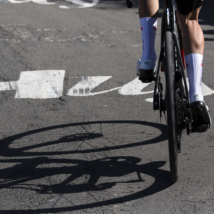 La Flèche Wallonne 2023 - Along the ascent of the Mur the word Huy is painted on the road with a bike shadow beneath to it