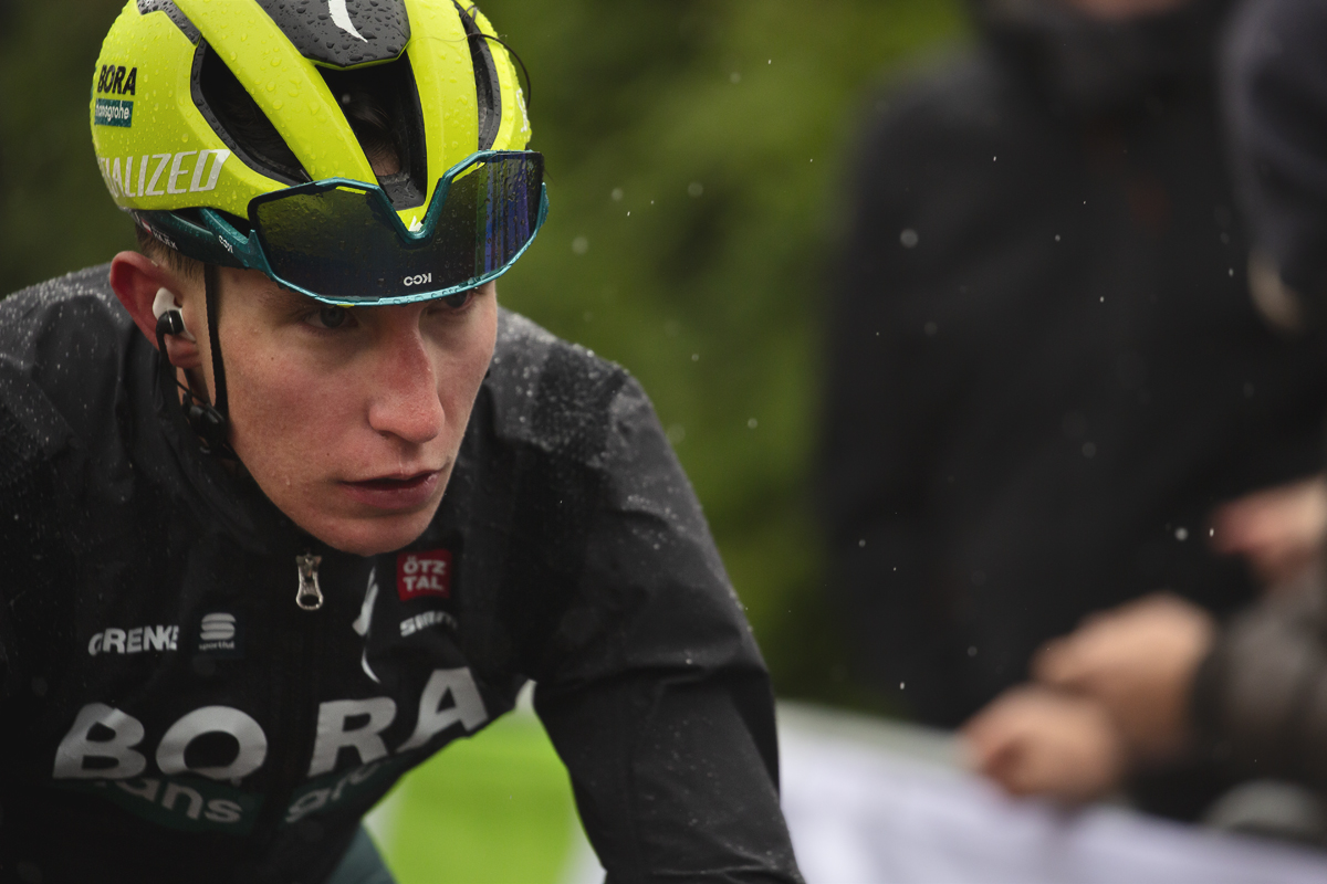 La Flèche Wallonne 2024 - Alexander Hajek of BORA - hansgrohe with his glasses on his helmet to help his vision on a miserable day on the Mur de Huy