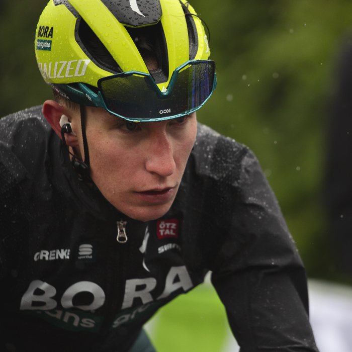 La Flèche Wallonne 2024 - Alexander Hajek of BORA - hansgrohe with his glasses on his helmet to help his vision on a miserable day on the Mur de Huy