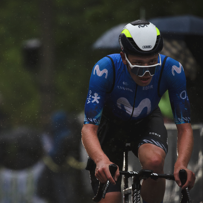 La Flèche Wallonne 2024 - Iván Romeo of Movistar Team looks over his glasses to see through the rain as he climbs the Mur de Huy