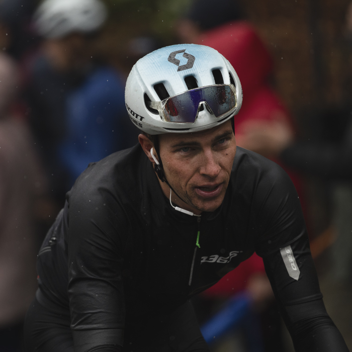 La Flèche Wallonne 2025 - Nickolas Zukowsky wearing his rain jacket as he climbs the Mur de Huy