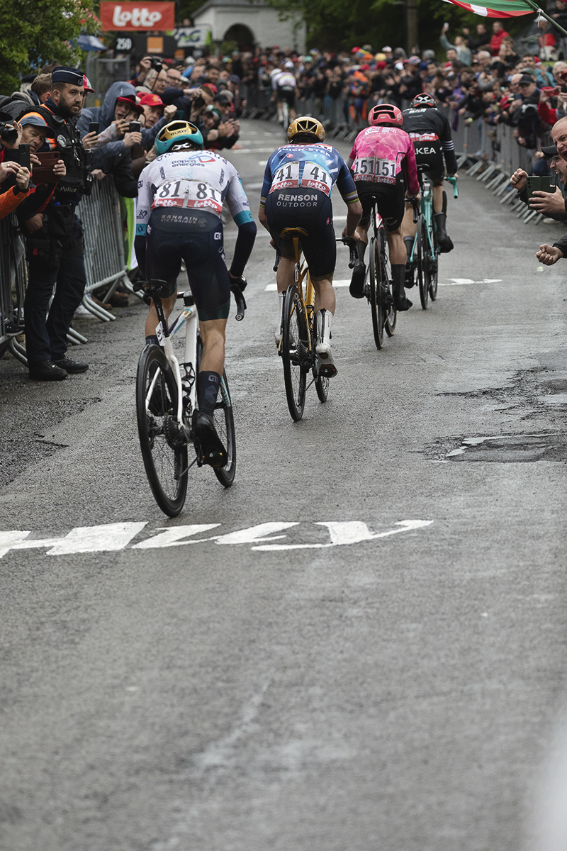 La Flèche Wallonne 2025 - Tadej Pogačar can be seen in the distance as the chasing group of riders try to catch him on the Mur de Huy