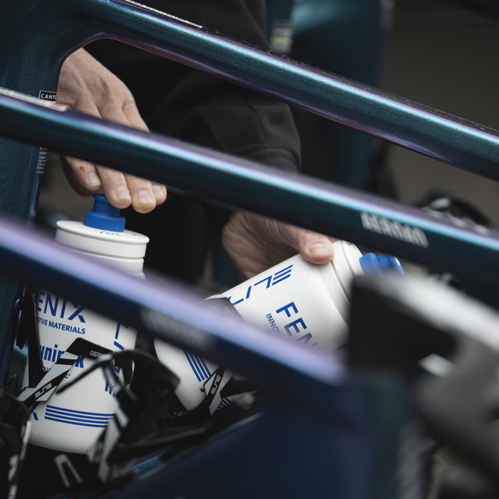 La Flèche Wallonne Femmes 2025 - Bidons are put into the cages of Fenix-Deceuninck bikes