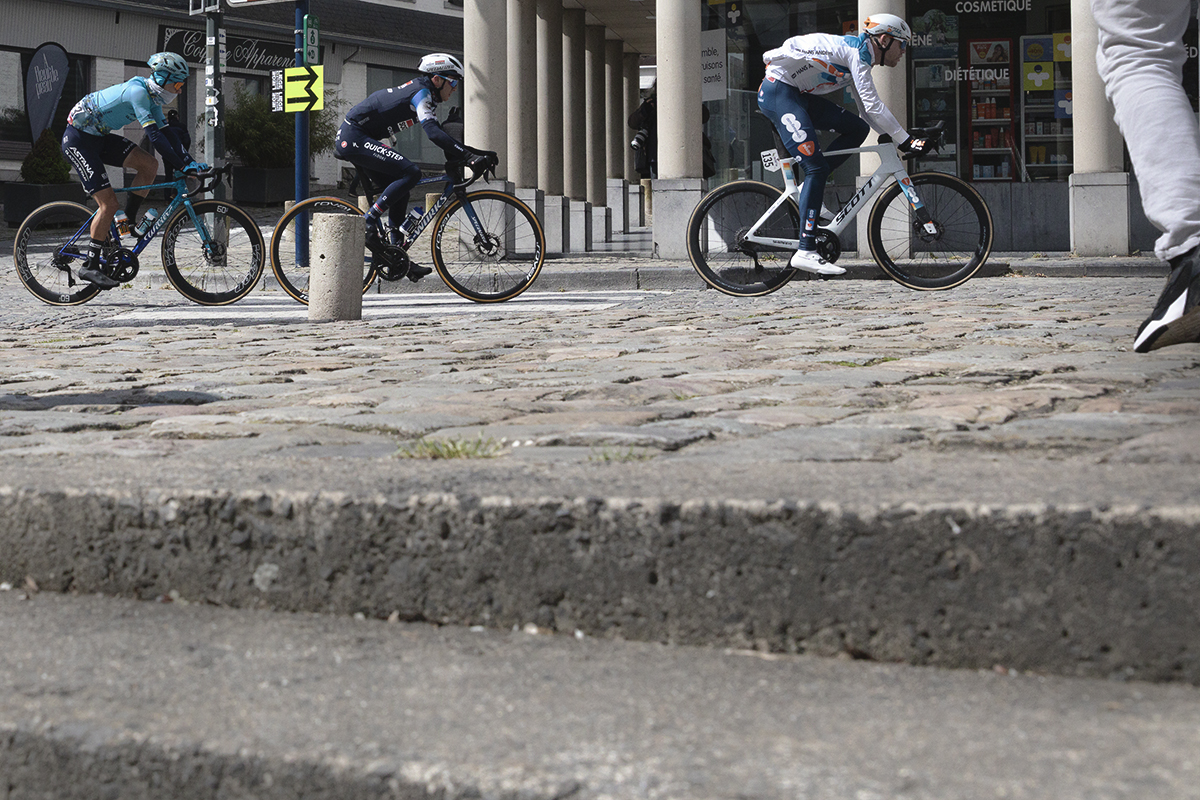 Liège-Bastogne-Liège 2024 - Riders viewed from street level looking up steps in Stavelot