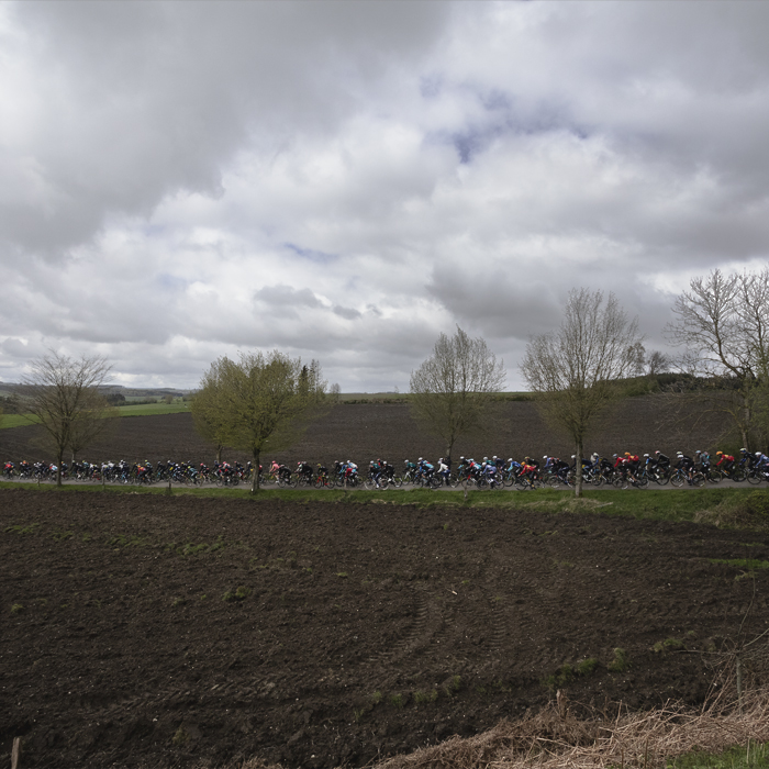 Liège-Bastogne-Liège 2024 - The race viewed across the fields at Vaux