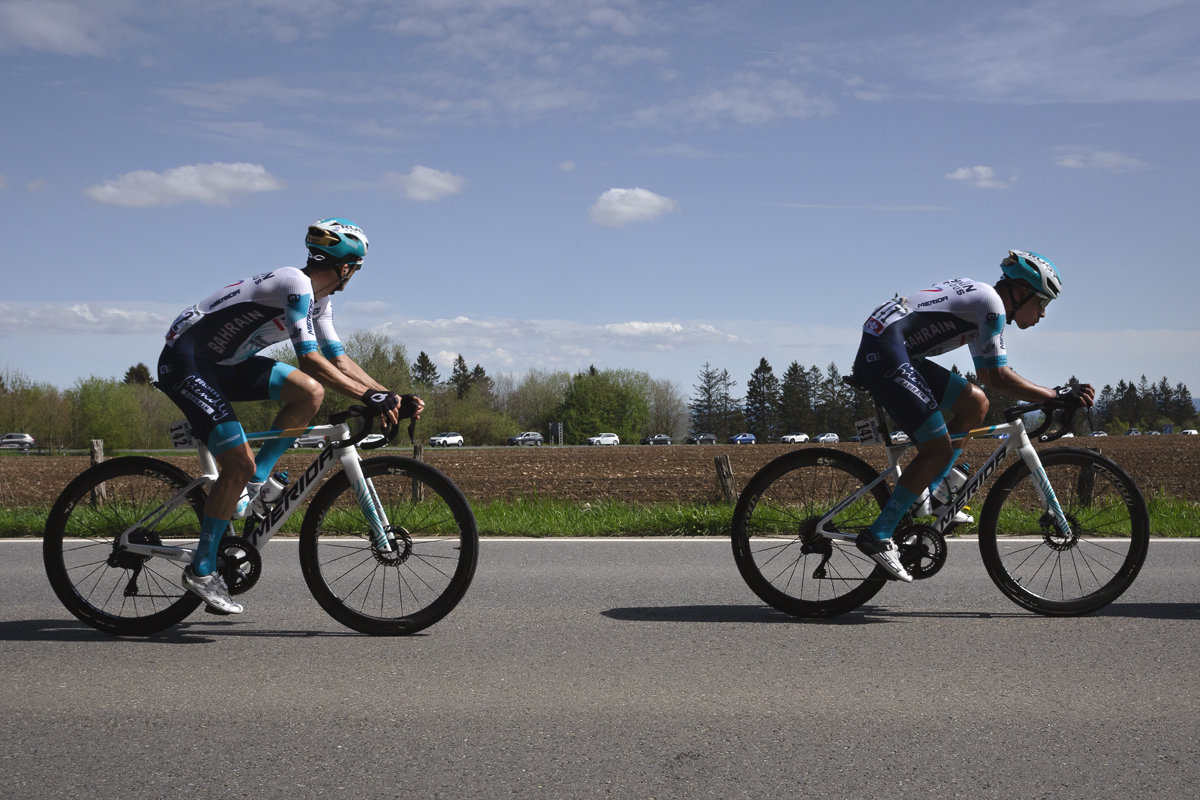 Liege Bastogne Liege 2025 - Pello Bilbao & Santiago Buitrago of Bahrain - Victorious on the road in front of a ploughed field