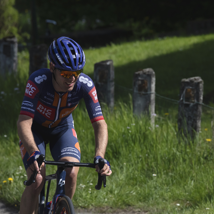 Liege Bastogne Liege 2025 - Chris Hamilton rides past fields