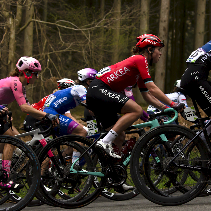 Liège-Bastogne-Liège Femmes 2023 - A side view of riders in the woodland on the Faix du Diable 