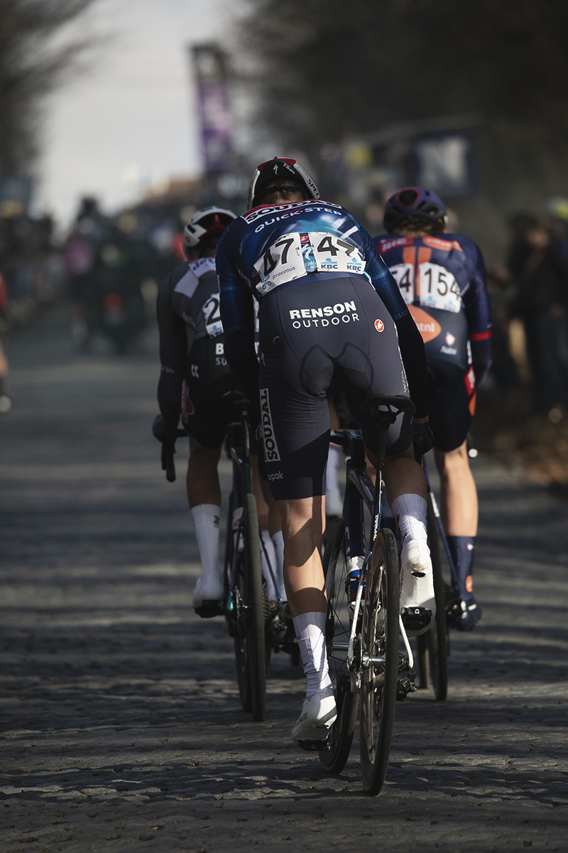 Omloop Nieuwsblad 2025 - A group of riders from behind on the Bosberg
