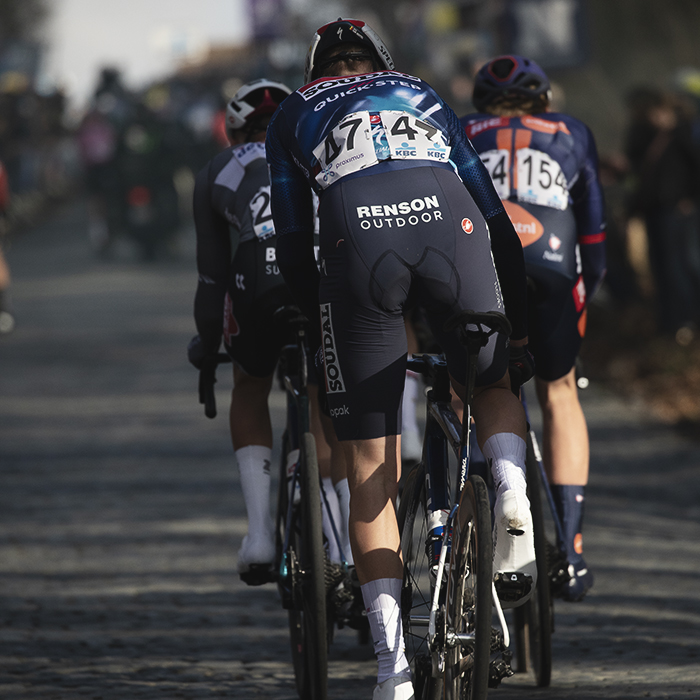 Omloop Nieuwsblad 2025 - A group of riders from behind on the Bosberg