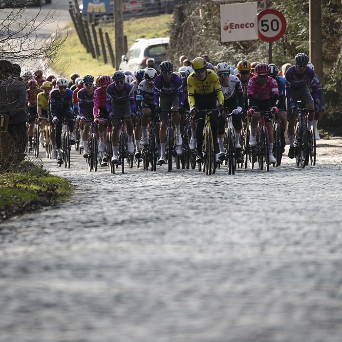 Omloop Nieuwsblad 2025 - A group of riders approach the Bosberg