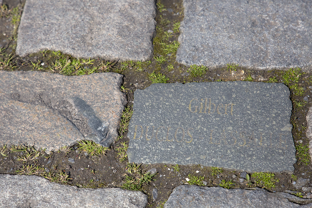 Paris Roubaix 2023 - Cobbles on the Wallers à Hélesmes sector showing the name of a benefactor