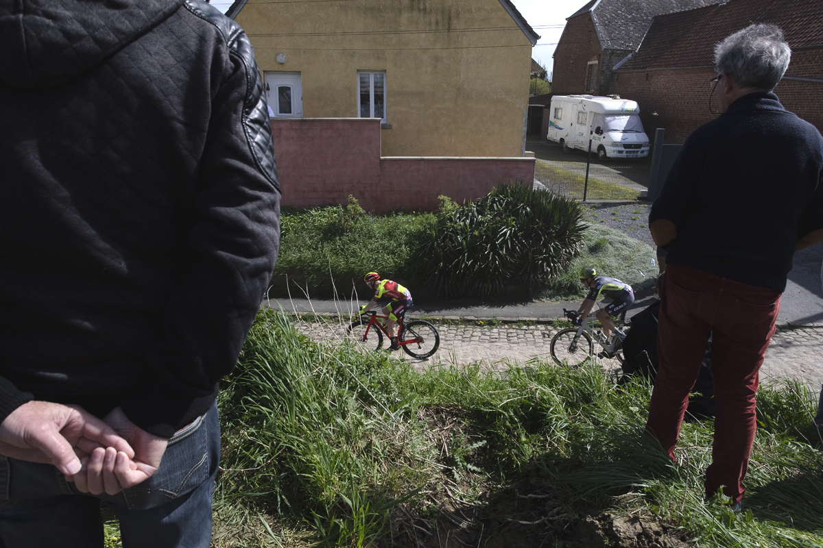 Paris Roubaix 2024 - Riders are framed by fans on the Quiévy à Saint-Python sector
