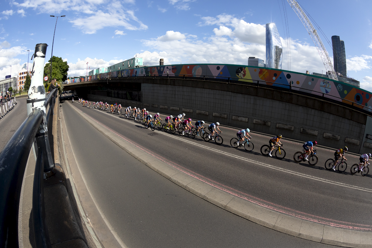 RideLondon Classique 2022 - The riders exit Blackfriars Underpass with The City in the background