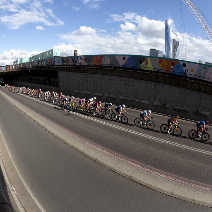 RideLondon Classique 2022 - The riders exit Blackfriars Underpass with The City in the background