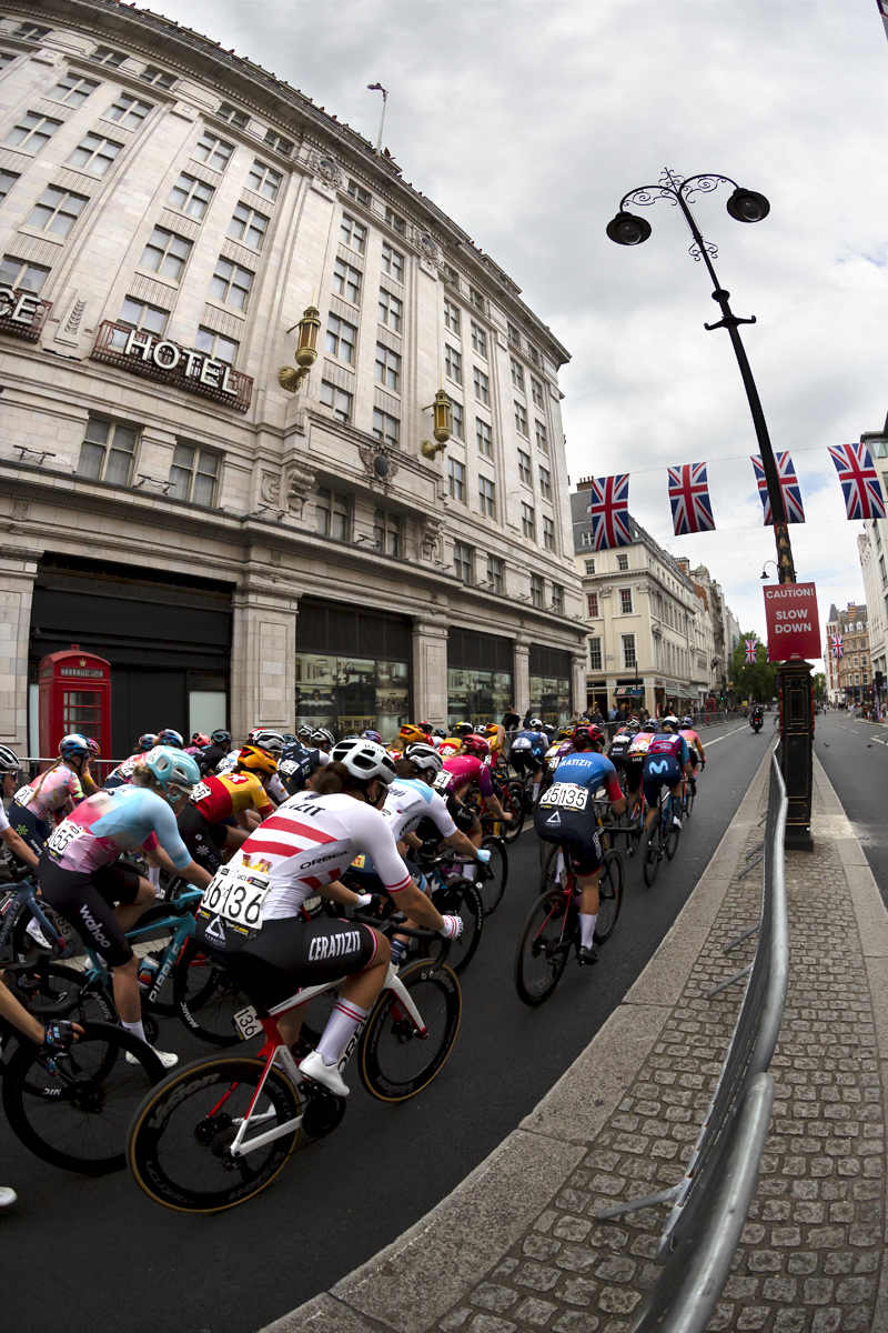 RideLondon Classique 2022 -The peloton passes by a traditional red telephone box