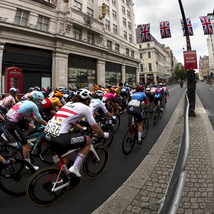 RideLondon Classique 2022 -The peloton passes by a traditional red telephone box