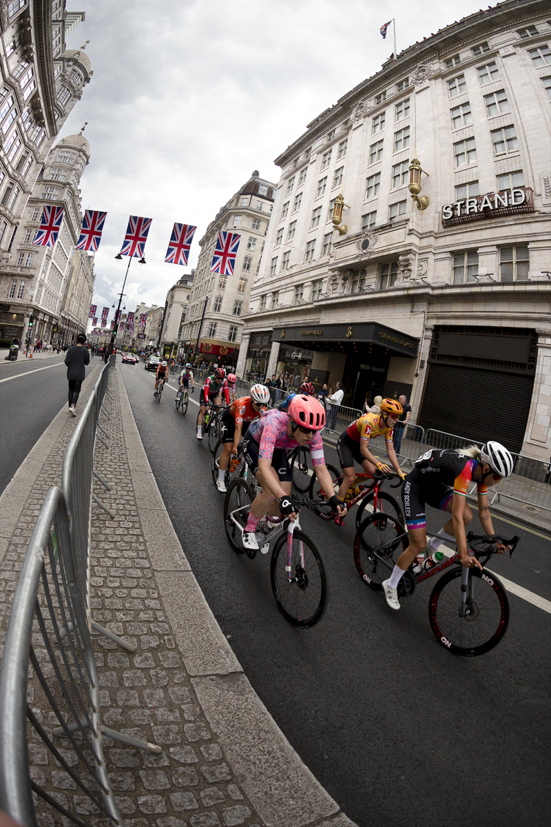 RideLondon Classique 2022 - Riders pass underneath Union Jack bunting