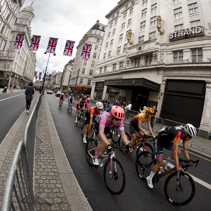 RideLondon Classique 2022 - Riders pass underneath Union Jack bunting