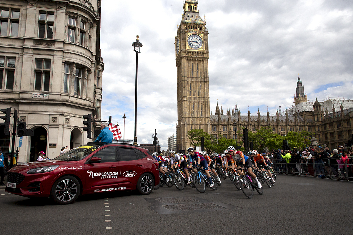 RideLondon Classique 2022 - The Race Directors car prepares to officially start the race as it passes the Houses of Parliament in Westminster