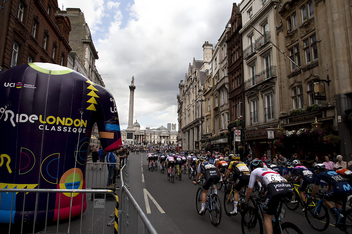 RideLondon Classique 2022 - Riders make their way to Trafalgar Square with an inflatable race jersey in the foreground