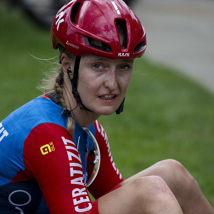 RideLondon Classique 2024 - Cédrine Kerbaol of CERATIZIT-WNT Pro Cycling Team sits of the grass exhausted after stage one of the race