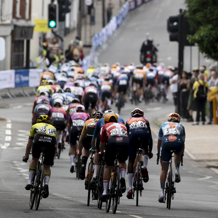 RideLondon Classique 2024 - The peloton seen just before the steep road of the final climb in Colchester