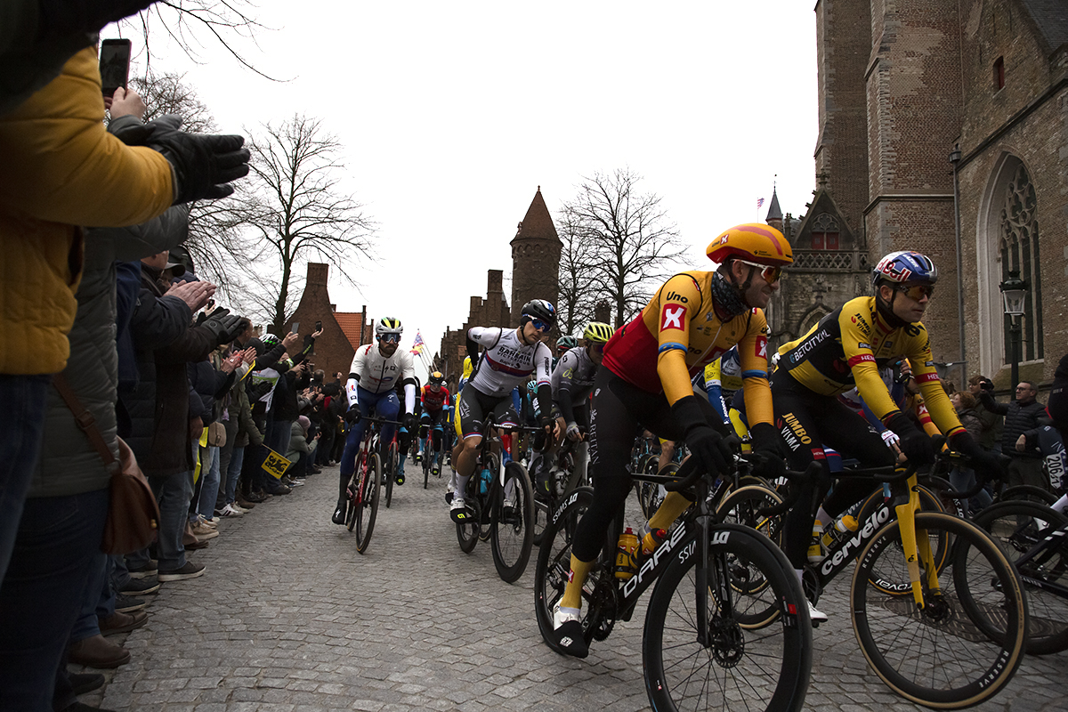 Ronde van Vlaanderen 2023 - Alexander Kristoff of Uno-X Pro Cycling Team and Wout van Aert of Jumbo-Visma lead the riders through the streets of Brugge