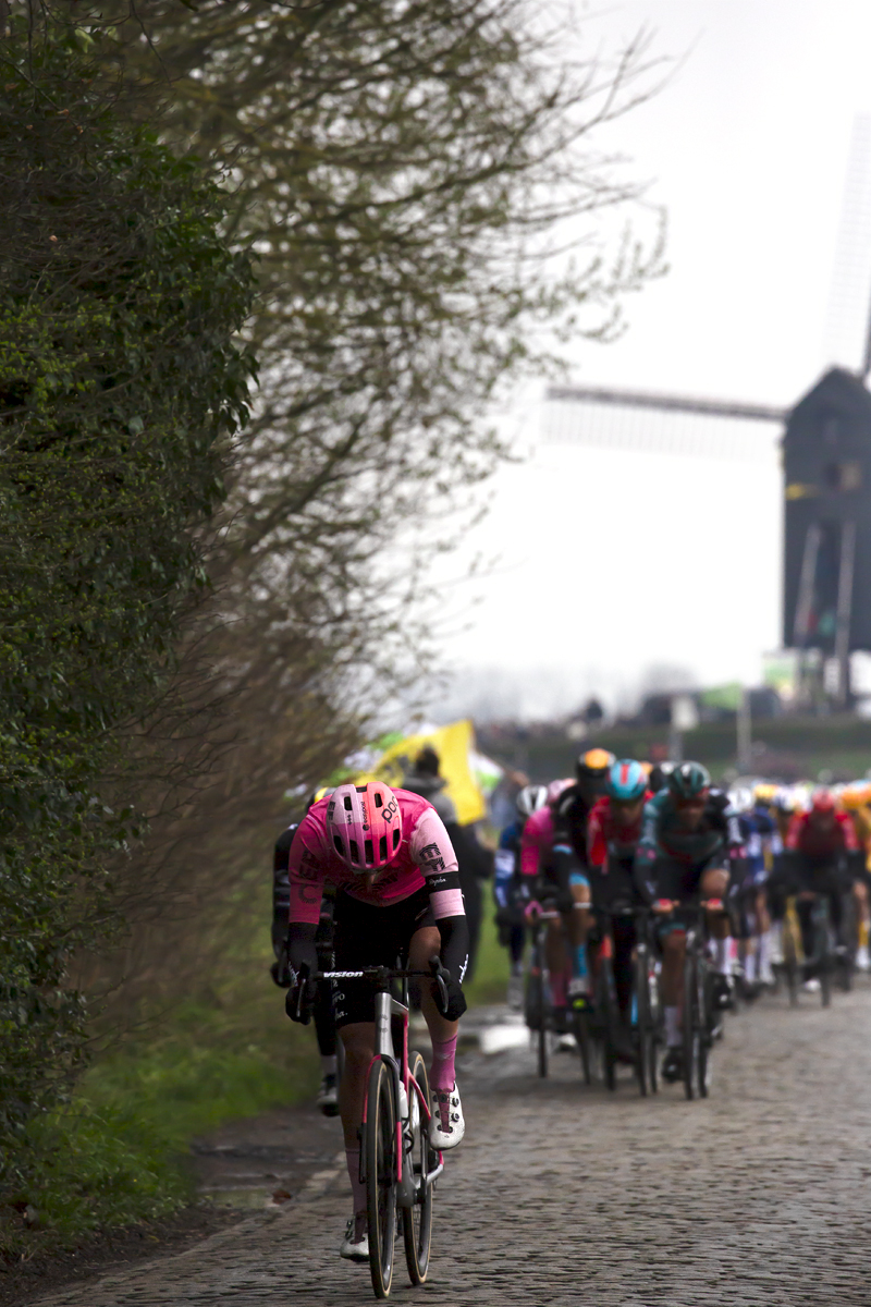 Ronde van Vlaanderen 2023 - A member of the EF Education–EasyPost Team lowers their head as they push on down Huisepontweg