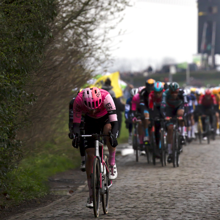 Ronde van Vlaanderen 2023 - A member of the EF Education–EasyPost Team lowers their head as they push on down Huisepontweg