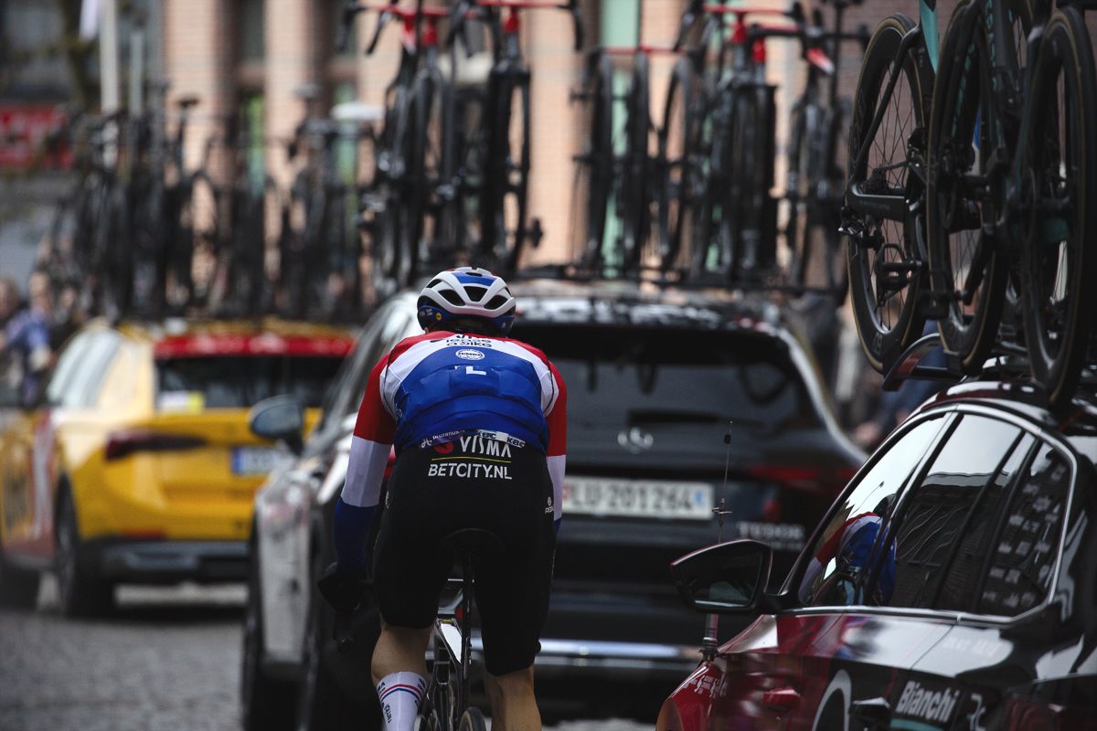 Ronde van Vlaanderen 2024 - Dylan van Baarle rides in among the team cars