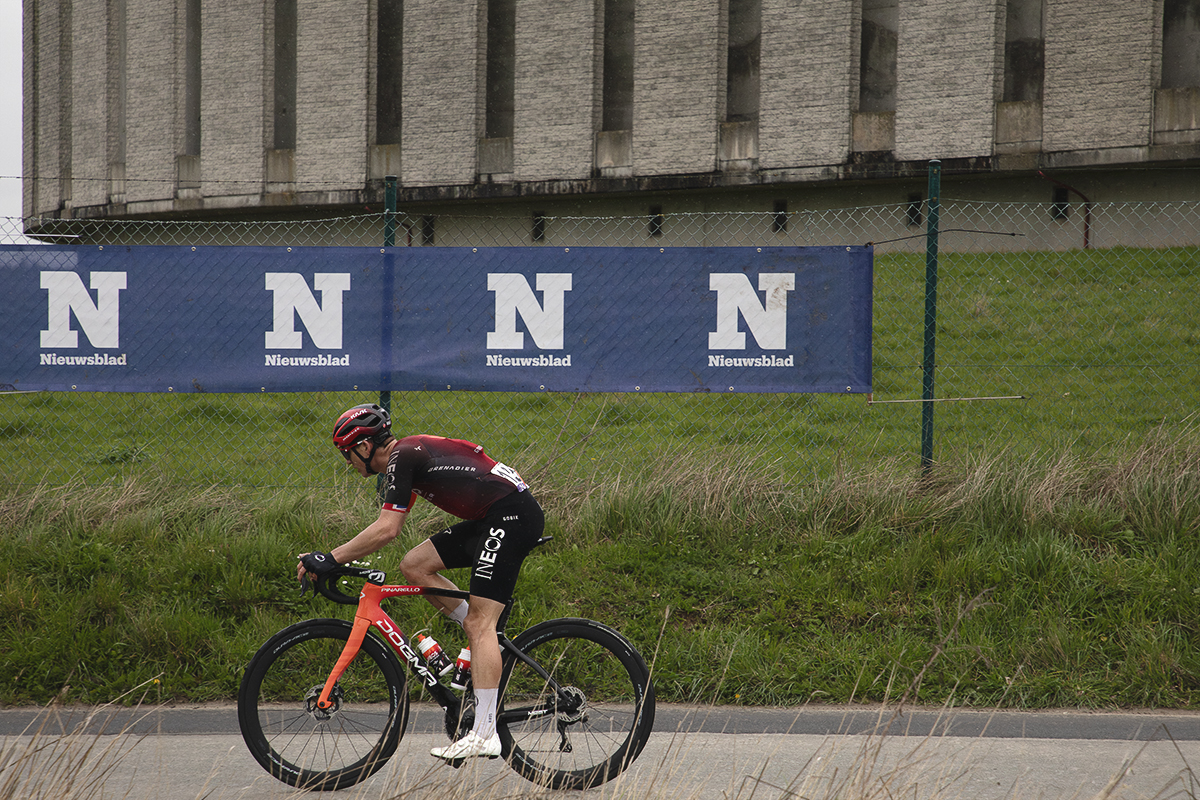 Ronde van Vlaanderen 2024 - Ben Swift in front of Nieuwsblad banners