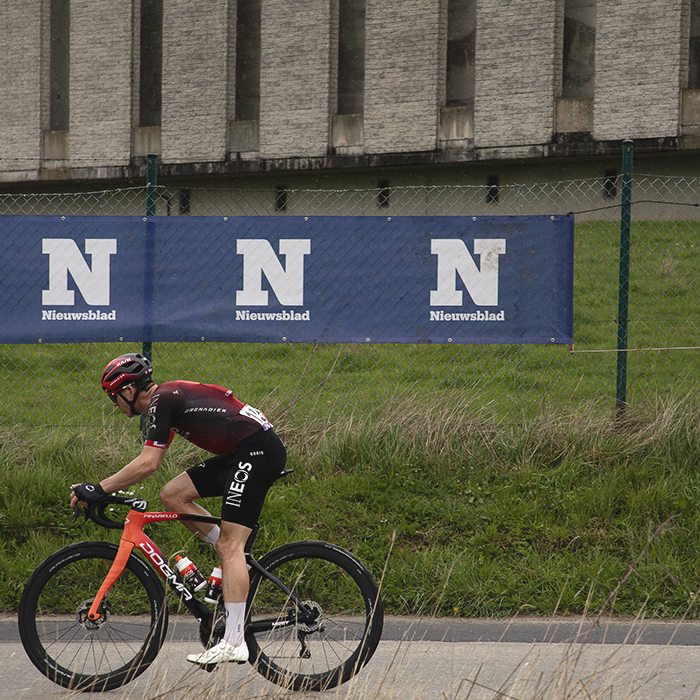 Ronde van Vlaanderen 2024 - Ben Swift in front of Nieuwsblad banners